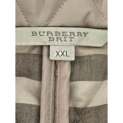 BURBERRY BRIT. Beige quilted jacket in polyester....