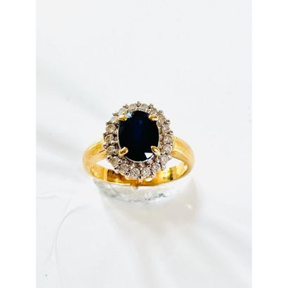 Yellow gold flower ring set with an oval...