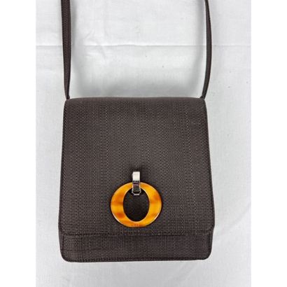 DIOR. Brown fabric clutch. Closing by a silver...