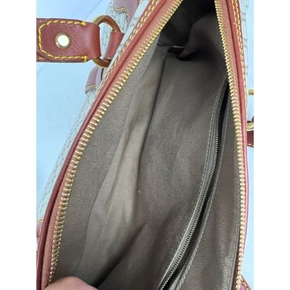 CELINE. Baguette in monogram canvas and gold...