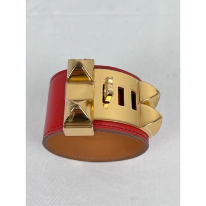 HERMES Paris. Dog collar bracelet in orange-red...
