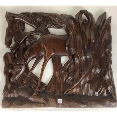Low relief in teak representing an antelope...