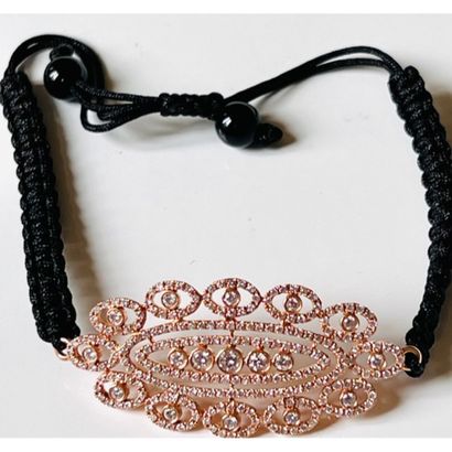 BRACELET in pink gold 750°/°° and black cord...