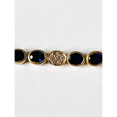 BRACELET line in yellow gold 750°/°° set...