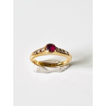 Yellow gold ring set with a ruby and 6 diamonds....