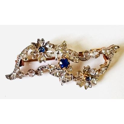 2 gold pin with floral design decorated with...