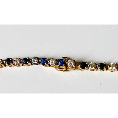 BRACELET tennis in yellow gold 750°/°° decorated...