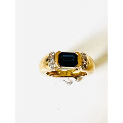 Yellow gold ring set with a rectangular sapphire...
