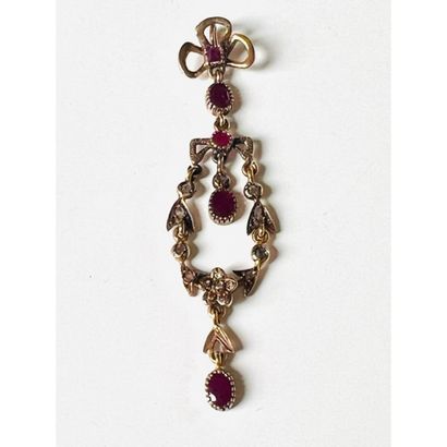 1880. A rose gold pendant with a floral design...
