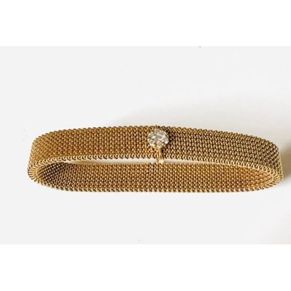 GOLDEN METAL BRACELET decorated with a sliding...