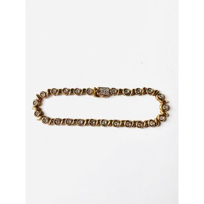 BRACELET line in yellow gold 750°/°° set...
