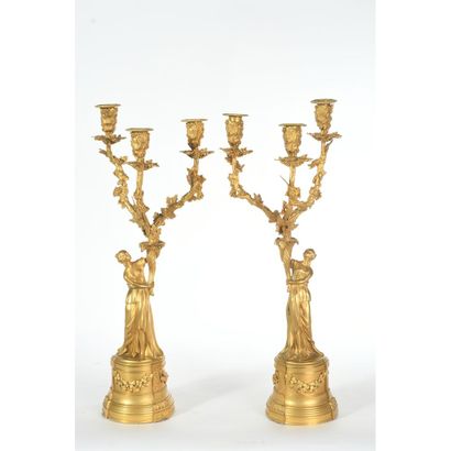 A PAIR OF RESTAURATION CANDELABRES in gilded...
