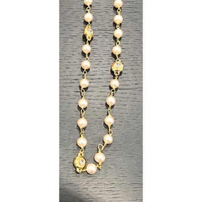 CHANEL. Sautoir in gilded metal interspersed...