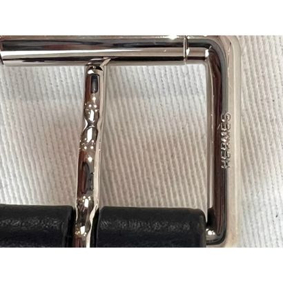 HERMES. Black grained leather belt. Silver-plated...