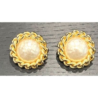 CHANEL. Pair of gilded metal clip earrings...