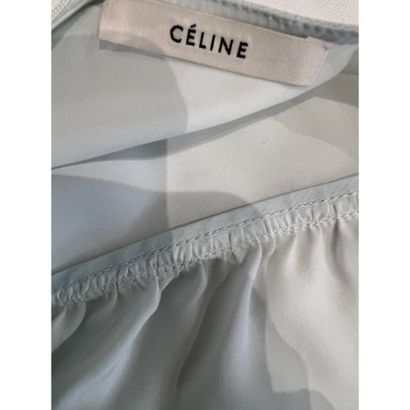 CELINE. Blouse habillée en soie verte céladon....