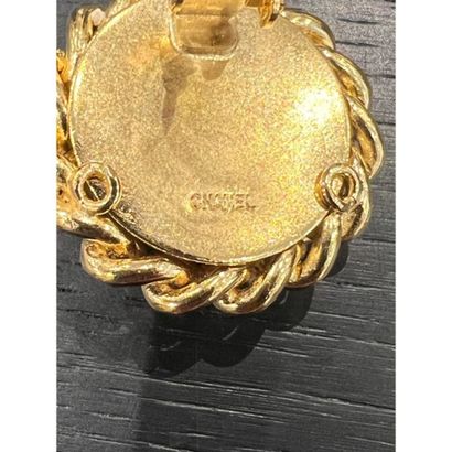CHANEL. Pair of gilded metal clip earrings...
