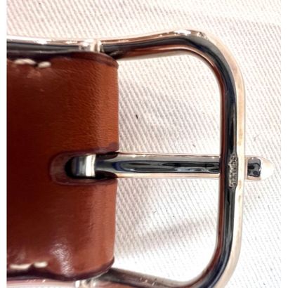 HERMES Paris. Tan leather and white saddle-stitched...