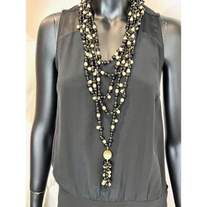 CHANEL. 5-row necklace in gilded metal interspersed...