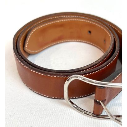 HERMES Paris. Tan leather and white saddle-stitched...