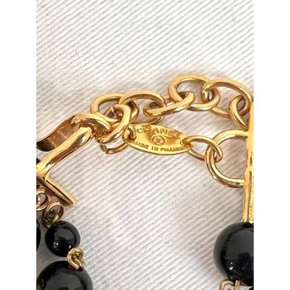 CHANEL. 5-row necklace in gilded metal interspersed...