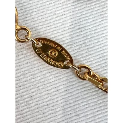 CHANEL. Gilded metal sautoir adorned with...