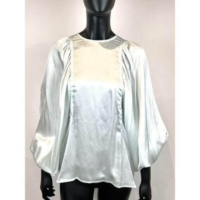 CELINE. Blouse habillée en soie verte céladon....