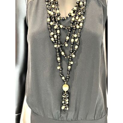 CHANEL. 5-row necklace in gilded metal interspersed...