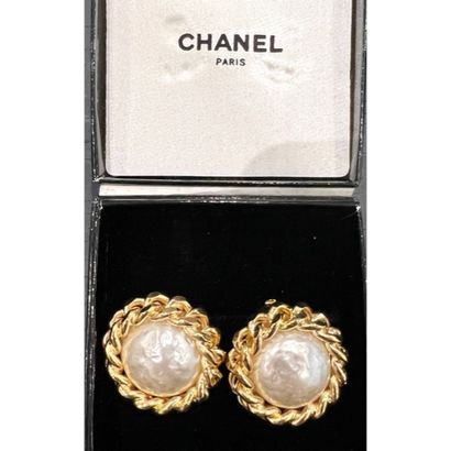 CHANEL. Pair of gilded metal clip earrings...