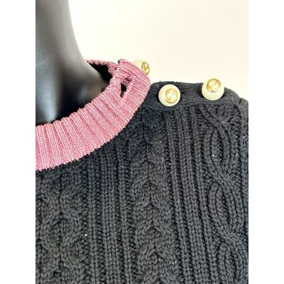GUCCI. Pull du soir en tricoté de laine noire....