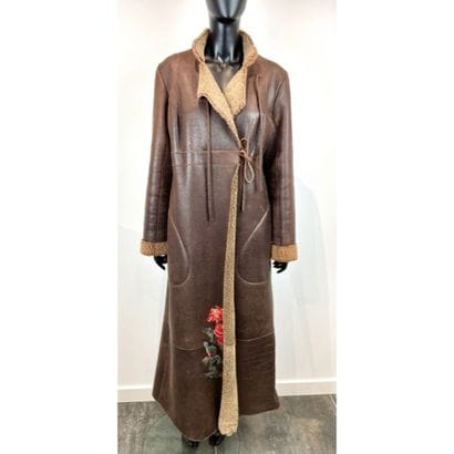 KENZO. Manteau long en agneau retourné marron...