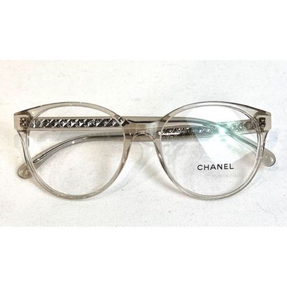 CHANEL. Lunettes de vue en plastique transparente....