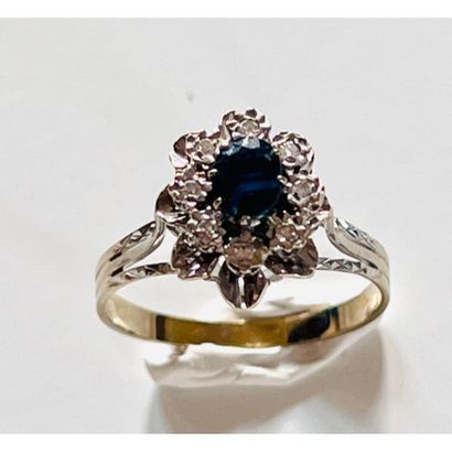 RING in white gold 750°/°° set with a sapphire...