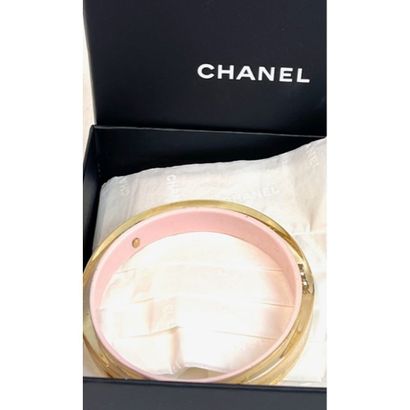 CHANEL. Rigid bracelet in transparent Plexiglas...