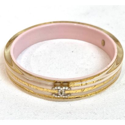 CHANEL. Rigid bracelet in transparent Plexiglas...