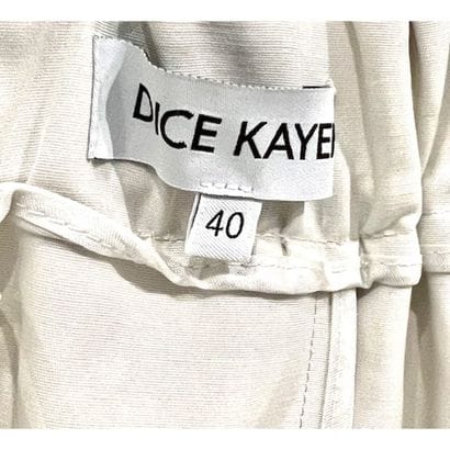 DICE KAYEK. Jupe évasée à plis plats en coton...