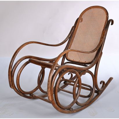 THONET. Rocking'Chair in bentwood. Cane seat...