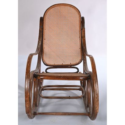 THONET. Rocking'Chair in bentwood. Cane seat...