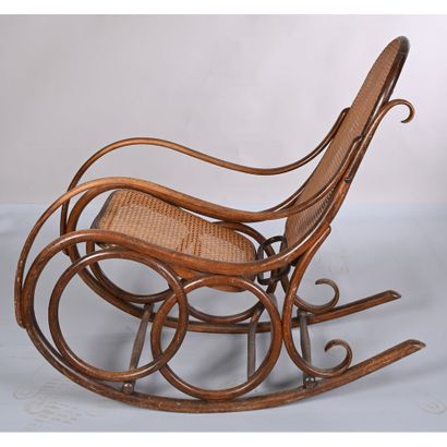 THONET. Rocking'Chair in bentwood. Cane seat...
