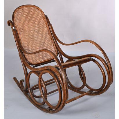 THONET. Rocking'Chair in bentwood. Cane seat...