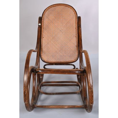 THONET. Rocking'Chair in bentwood. Cane seat...