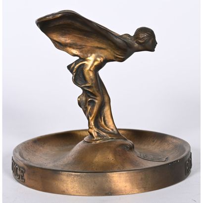 ROLLS-ROYCE. Bronze mascot with a golden-brown...