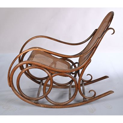 THONET. Rocking'Chair in bentwood. Cane seat...
