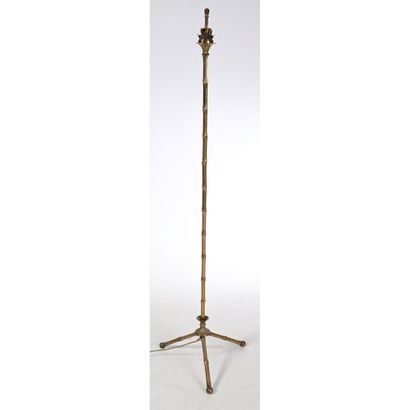 ADNET Jacques. LAMPADAIRE en bronze et laiton...