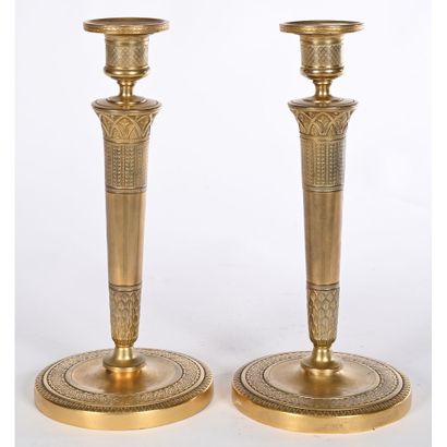 PAIR OF EMPIRE CANDLES in gilded bronze with...