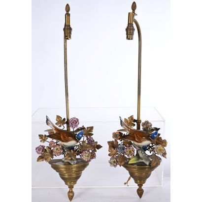 Pair of bronze and porcelain sconces depicting...