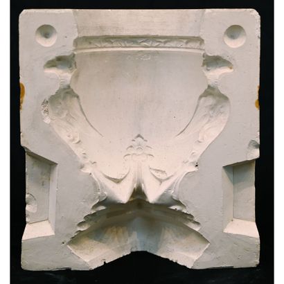 VASE in plaster with winged griffin motifs...