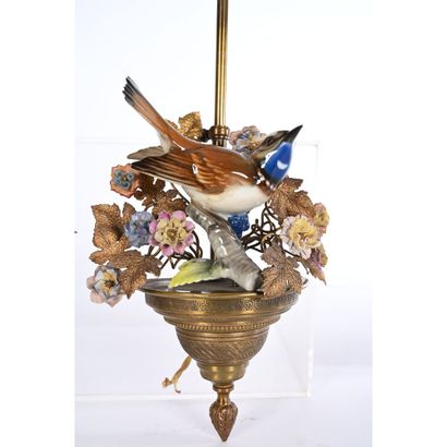 Pair of bronze and porcelain sconces depicting...