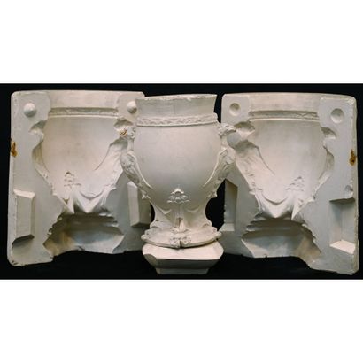 VASE in plaster with winged griffin motifs...