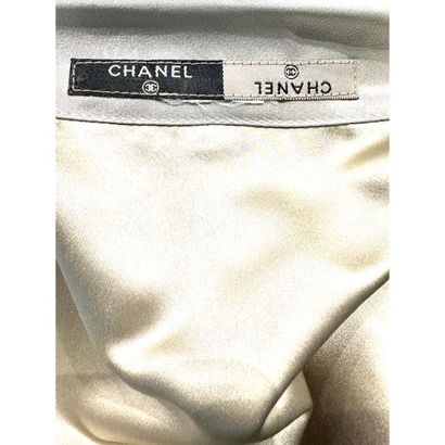 CHANEL. Evening jacket in silver silk satin...